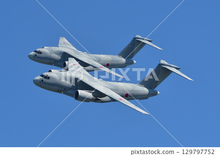 C-2 transport aircraft maneuvering in formation 129797752