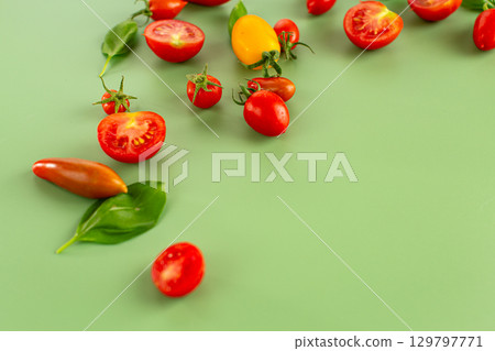 Assorted cherry tomatoes halves seeds and juicy pulp closeup 129797771