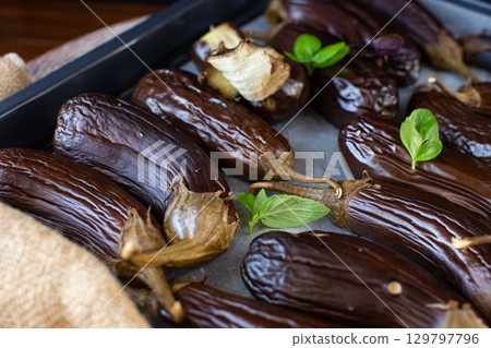 juicy eggplants with crust and herbs fragrant still life 129797796