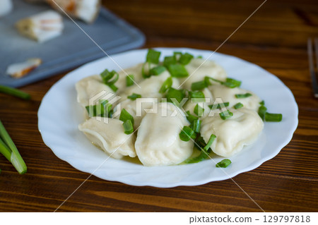 Homemade dumplings with potato filling and fresh herbs Homemade dumplings with potato filling and fresh herbs 129797818