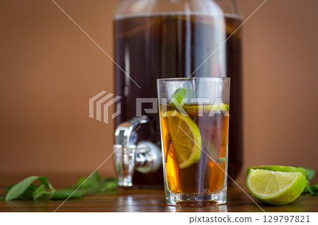 Kombucha with kombucha and mint on a rustic table 129797821