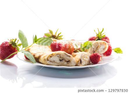 Sweet pancakes with cottage cheese and strawberries on top 129797830