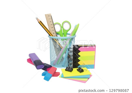 School and office supplies, pens, pencils, ruler, compass in a metal cup on a white background. School and office supplies, pens, pencils, ruler, compass in a metal cup on a white background. 129798087
