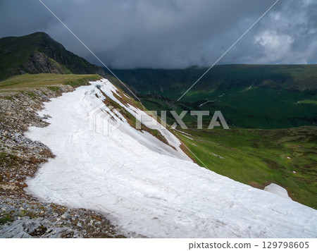 Snowy ledge. Natural landscape with mountains 129798605
