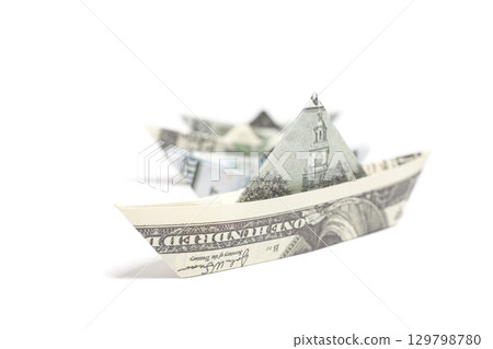 Money Origami boat with one hundred Dollar bills Money Origami boat with one hundred Dollar bills 129798780