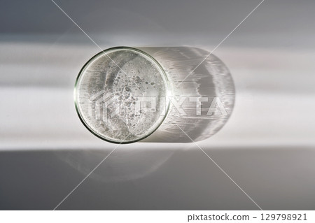 Petri dish with serum on a white background. 129798921