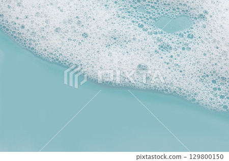 Texture of white foam. Cleansing mousse for the face or bath foam or washing powder. Copy space Texture of white foam. Cleansing mousse for the face or bath foam or washing powder. Copy space 129800150