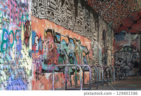 a row of metal structures in Leake Street Arches (Banksy Tunnel) that serve as bicycle wheel locks. a row of metal structures in Leake Street Arches (Banksy Tunnel) that serve as bicycle wheel locks. 129801586