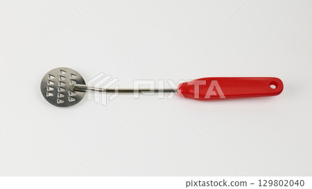 Mashing tool designed for preparing potatoes in the kitchen 129802040