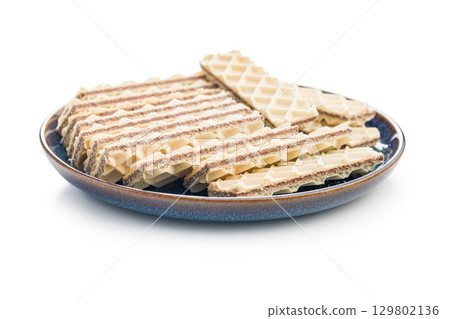 Sweet crispy wafers isolated on white background. 129802136