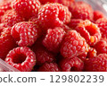 Fresh raspberries showing tiny hairs and seeds filling frame. Preparing for winter storage 129802239