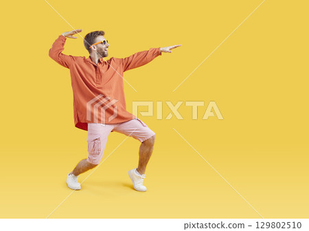 Full length body size view of attractive cheerful dancing man 129802510