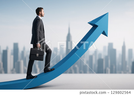 Businessman walking on giant blue arrow path with briefcase against city skyline, symbolizing career growth and success motivation 129802564