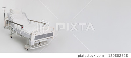 An Empty Hospital Bed Is Now Prepared and Ready for Patient Use and Care at This Facility 129802828