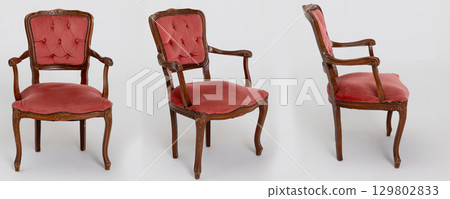 An Elegant Vintage Armchair featuring beautiful Pink Upholstery and Intricate Carvings An Elegant Vintage Armchair featuring beautiful Pink Upholstery and Intricate Carvings 129802833
