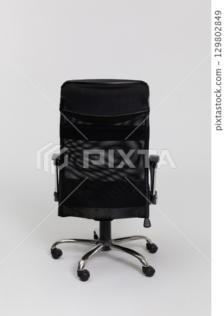 A stylish Ergonomic Black Office Chair on Wheels designed for maximum comfort and productivity A stylish Ergonomic Black Office Chair on Wheels designed for maximum comfort and productivity 129802849