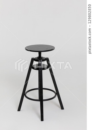 A Stylish Black Bar Stool that features an Adjustable Height for versatile use and comfort A Stylish Black Bar Stool that features an Adjustable Height for versatile use and comfort 129802850