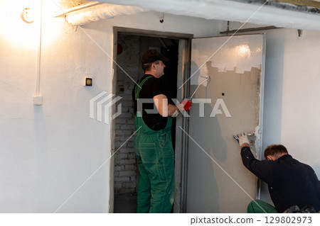 Skilled Professional Painters Engaged in Comprehensive Interior Renovation Projects 129802973