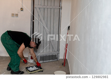 Interior Painting in Progress A Focus on Attention to Detail and Quality Craftsmanship 129802981