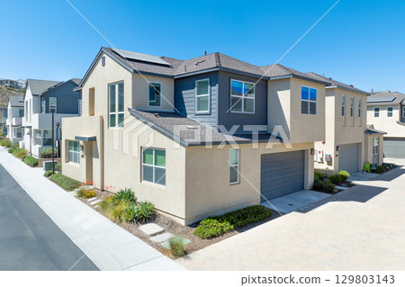 New development real estate. Aerial view of residential houses and driveways neighborhood in south San Diego, Chula Vista 129803143