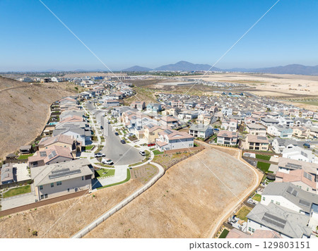 New development real estate. Aerial view of residential houses and driveways neighborhood in south San Diego, Chula Vista 129803151