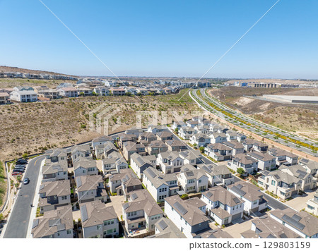 New development real estate. Aerial view of residential houses and driveways neighborhood in south San Diego, Chula Vista 129803159