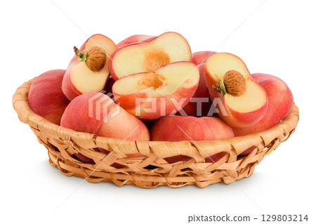 chinese flat donut peaches in a wicker basket isolated on white background chinese flat donut peaches in a wicker basket isolated on white background 129803214