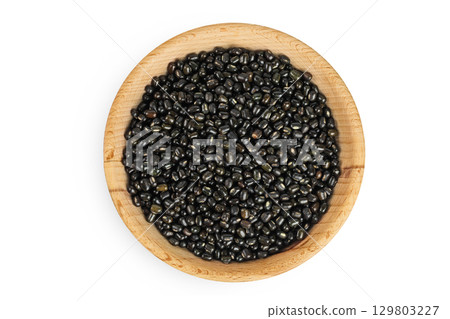 Black bean or Urad dal, black gram, vigna mungo in wooden bowl isolated on the white background. Top view. Flat lay. Black bean or Urad dal, black gram, vigna mungo in wooden bowl isolated on the white background. Top view. Flat lay. 129803227