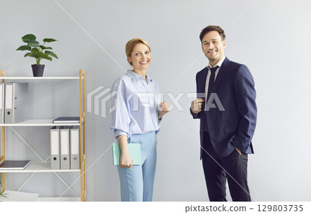 Portrait Of Happy Business Coworkers, Businessman, And Businesswoman In Office 129803735