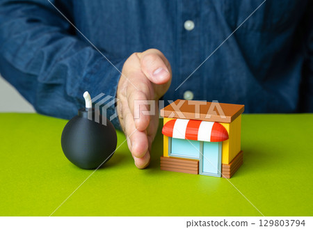 Man protects shop from bomb, concept. Business protection, damage insurance. 129803794