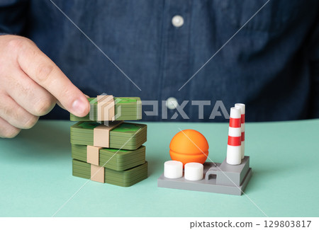 A man invests in a factory. Chemical and energy industry. Tax collection. 129803817
