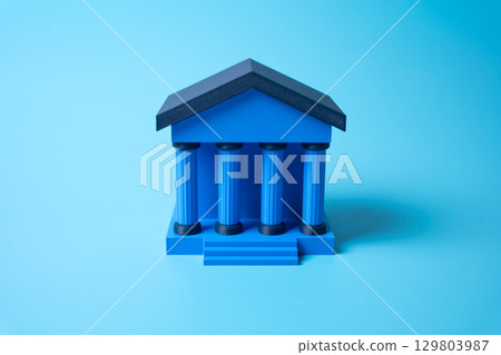 Bank building on blue background. Business and finance. Corporate loans. 129803987