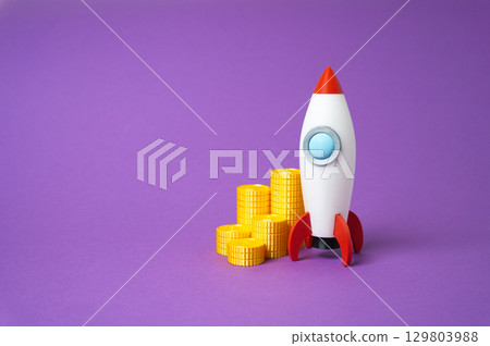 Rocket startup and money coins. Profitable business. Fundraising. Rocket startup and money coins. Profitable business. Fundraising. 129803988