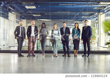 Business leaders with employees group full length portrait looking at camera, multicultural 129804124