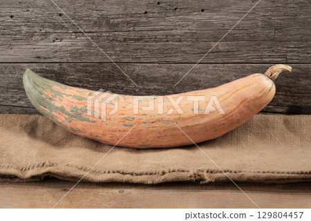 Autumn Harvest Candy Roaster Pumpkin on Hessian Autumn Harvest Candy Roaster Pumpkin on Hessian 129804457