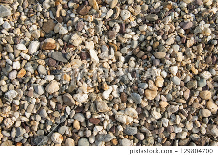 Natural river pebbles background with multicolored stones 129804700