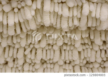 A closeup view of beautifully textured soft fabric showcasing aesthetic qualities and comfort A closeup view of beautifully textured soft fabric showcasing aesthetic qualities and comfort 129804803