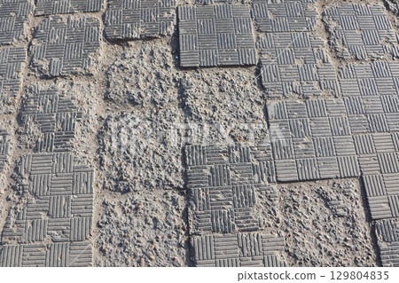 Detailed overview of Textured Pavement that exhibits various Wear and Tear Patterns Detailed overview of Textured Pavement that exhibits various Wear and Tear Patterns 129804835