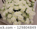 An elegant bouquet of pristine white roses, ideal for any memorable special occasion 129804849