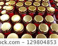 A Beautiful Array of Sealed Glass Jars with Stunning Gold Lids for Various Uses 129804853