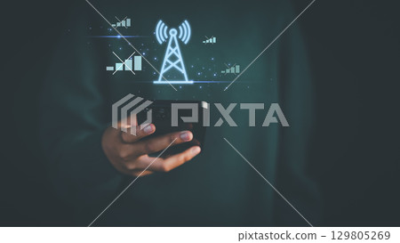 The mobile network is not working. Hand holding a smartphone with glowing signal tower and disconnected icons, illustrating network issues, weak signal, or no connection concept. The mobile network is not working. Hand holding a smartphone with glowing signal tower and disconnected icons, illustrating network issues, weak signal, or no connection concept. 129805269