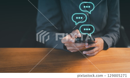 Young woman using a smartphone with technology smart robot AI chatbot for chat. Digital chatbot are assistant conversation for provide access to data growth of business in online network. Young woman using a smartphone with technology smart robot AI chatbot for chat. Digital chatbot are assistant conversation for provide access to data growth of business in online network. 129805271