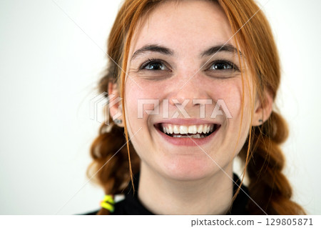 Close up portrait of redhead pretty teenage girl. 129805871