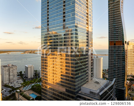 Downtown district of Miami Brickell in Florida, USA. Evening urban landscape of waterfront skyscraper buildings in modern American megapolis 129806536