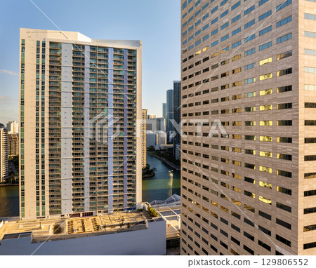 Miami, Florida, USA. Aerial view of American downtown office district at sunset. High commercial and residential skyscraper buildings in modern US city 129806552