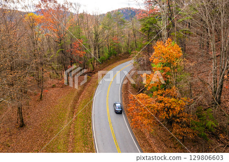 Blue Ridge Parkway in full autumn splendor. North Carolina mountain highway lined with brilliant red, orange, and gold foliage Blue Ridge Parkway in full autumn splendor. North Carolina mountain highway lined with brilliant red, orange, and gold foliage 129806603