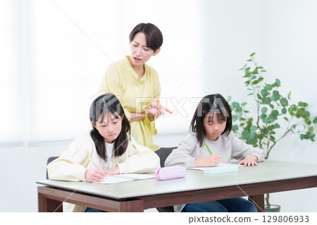 Studying girl, teacher, tutor, educational mom 129806933