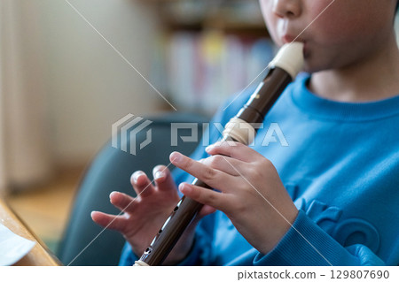 recorder, younger, blowing 129807690