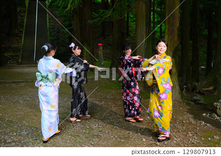 Women and girls wearing yukatas at the summer festival 129807913