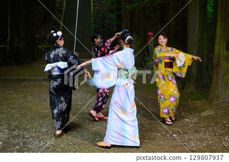 Women and girls wearing yukatas at the summer festival Women and girls wearing yukatas at the summer festival 129807937